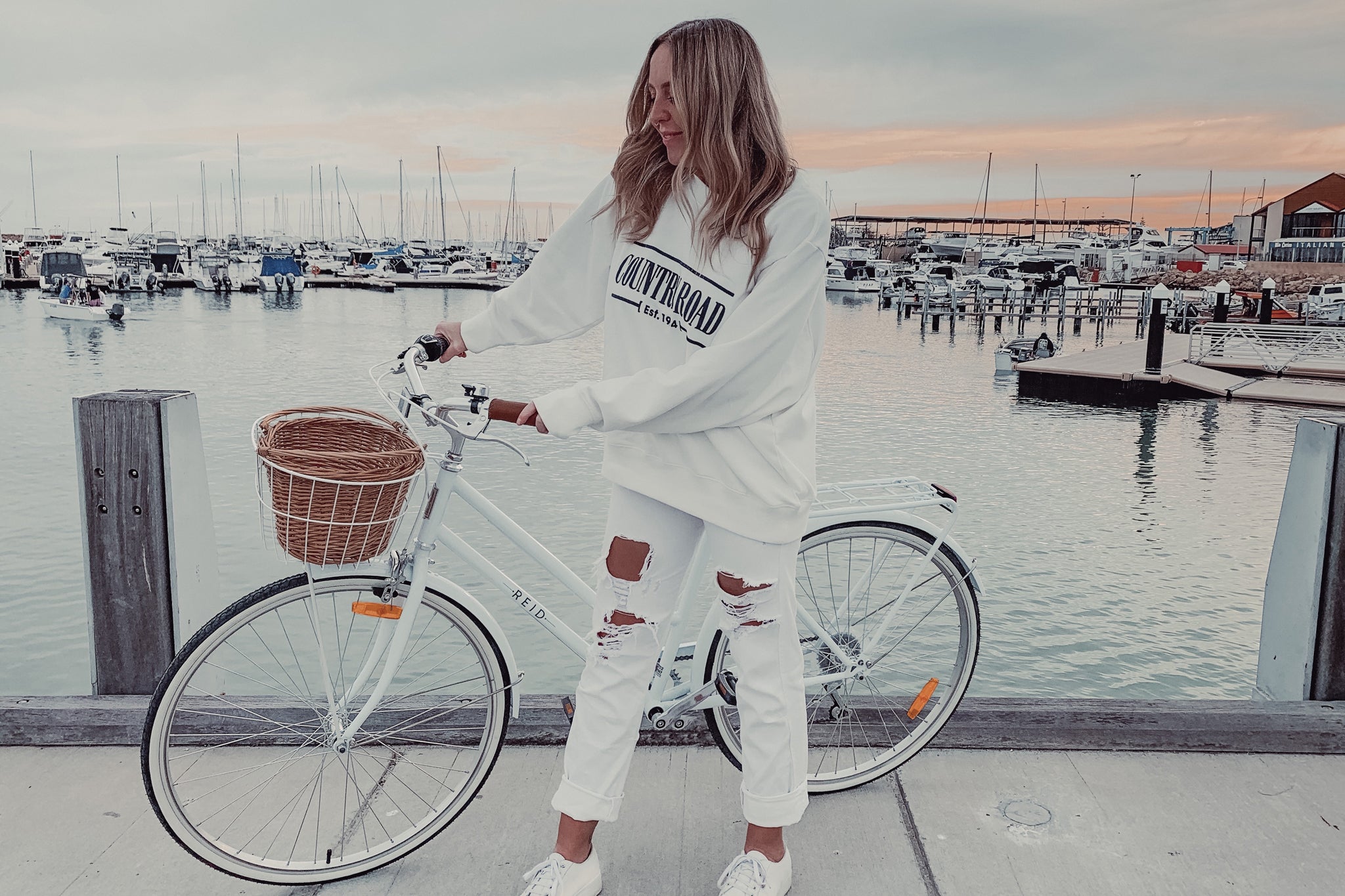 Girl on the store white bike